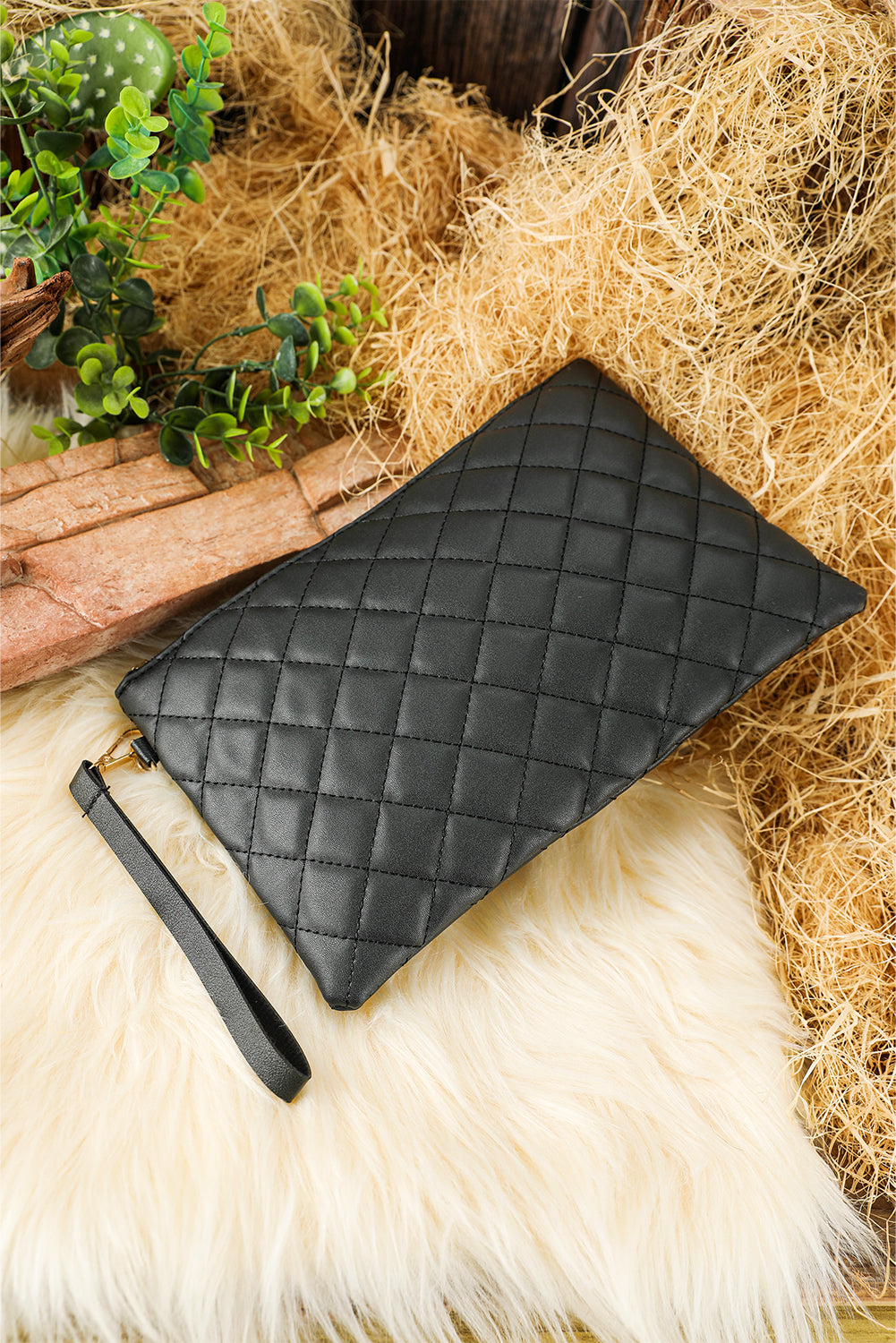 Black Quilted Leather Wrist Strap Clutch Bag