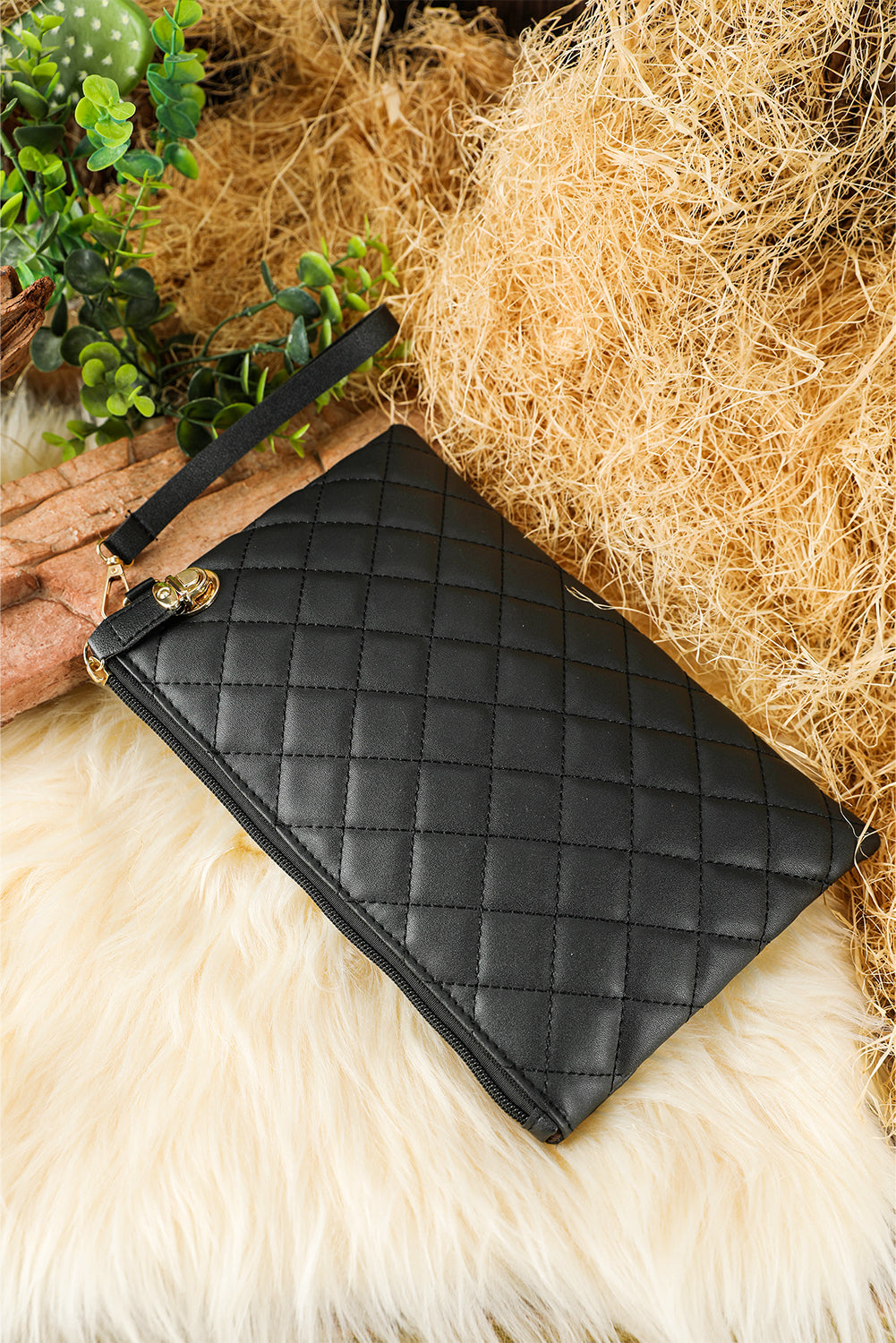 Black Quilted Leather Wrist Strap Clutch Bag