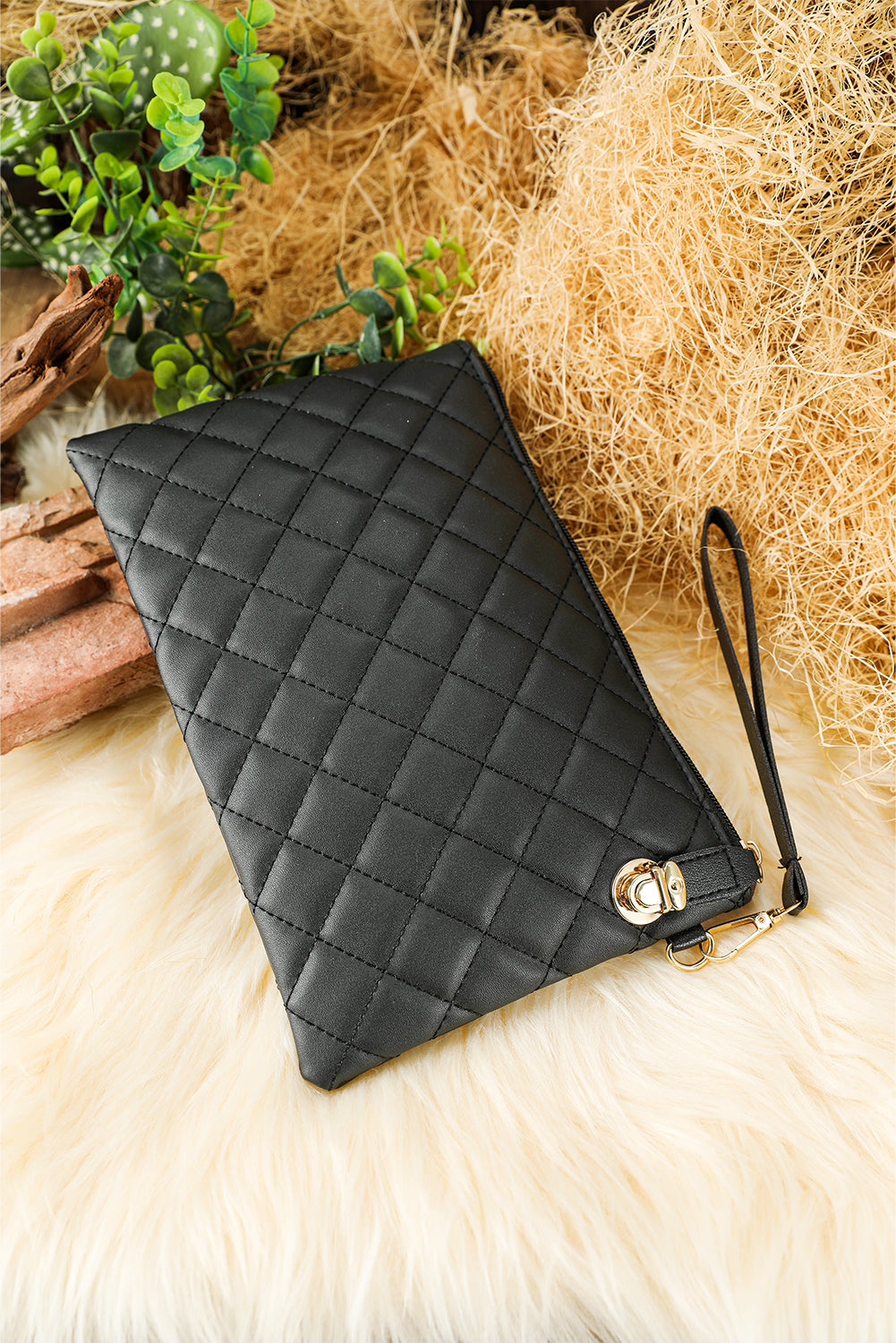 Black Quilted Leather Wrist Strap Clutch Bag